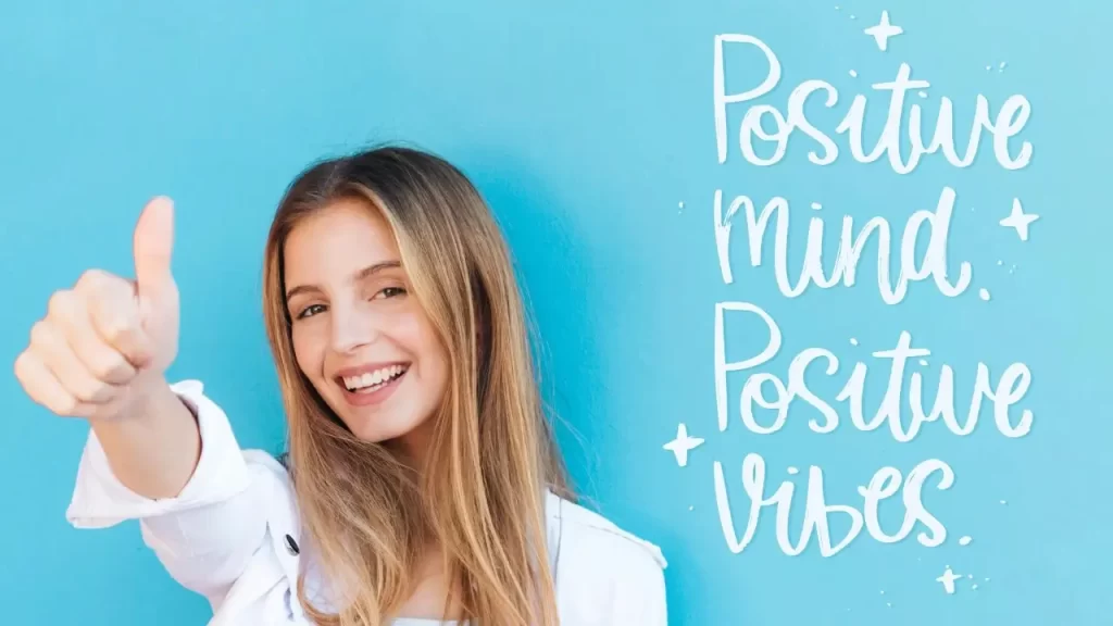 um quadro e uma mulher com sinal de positivo